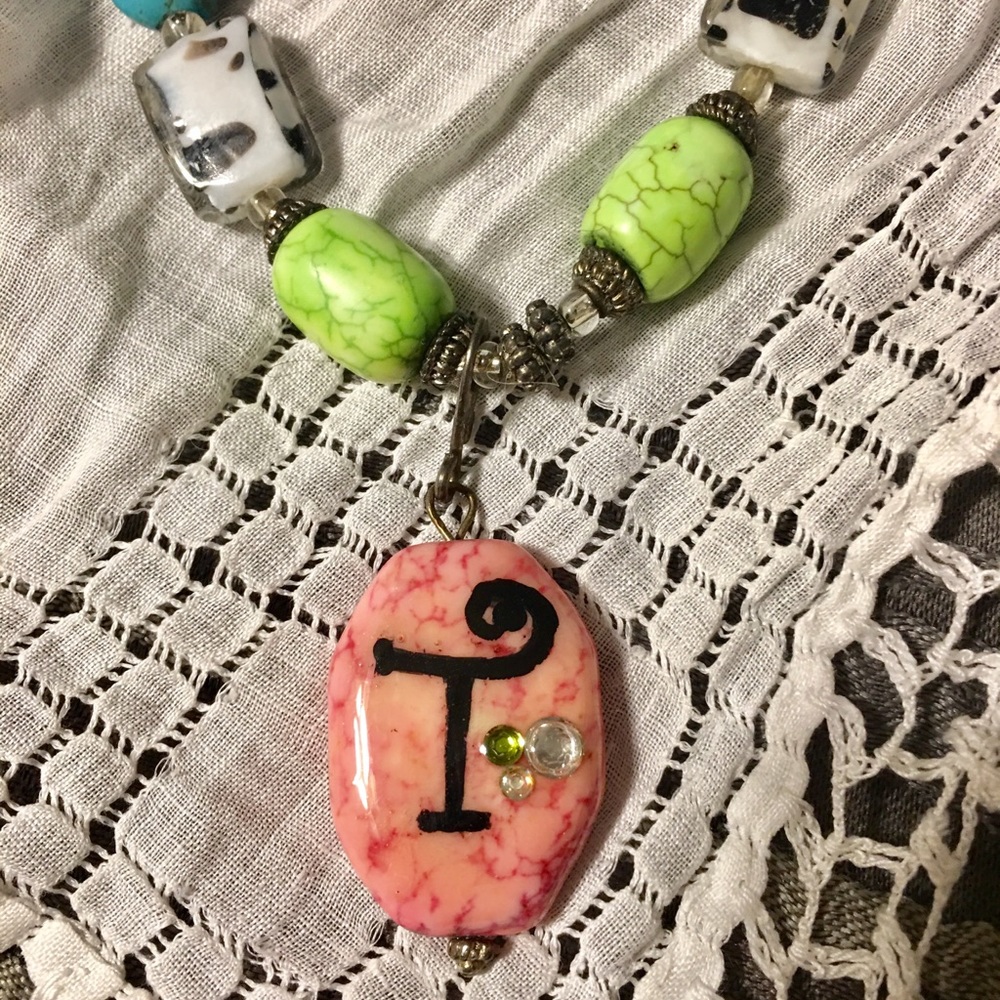 Chunky monogrammed "T" necklace.